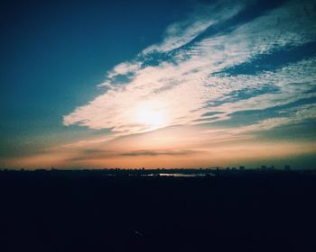 Silhouette of landscape against sunset sky