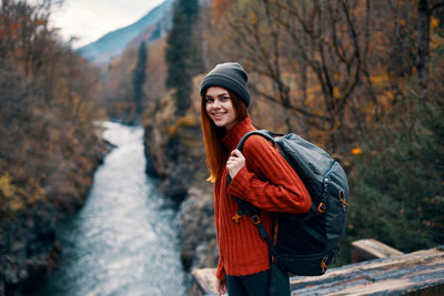 Young woman standing in park during winter