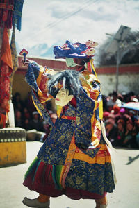 Close-up of woman standing against sky