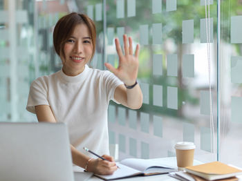 Portrait of a young woman using mobile phone