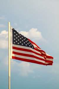 Low angle view of flag against sky