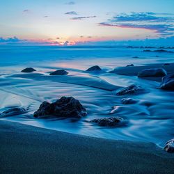 Scenic view of sea against sky during sunset