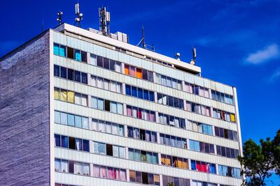 Low angle view of building against blue sky