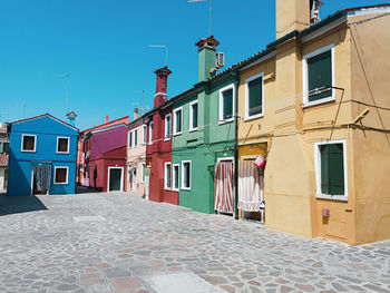 Multi colored buildings against sky