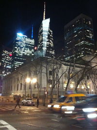 Illuminated city street at night