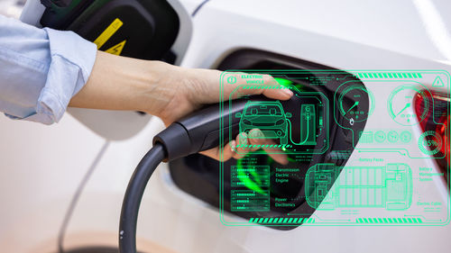 Cropped hand of man repairing car