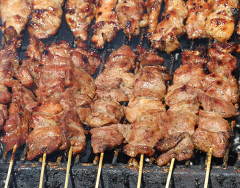 High angle view of meat on barbecue