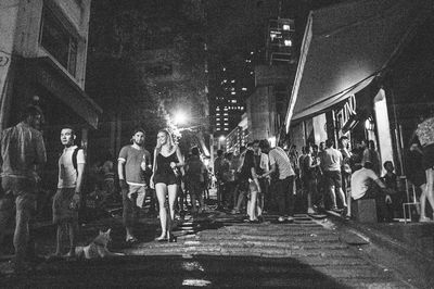 People walking on street at night