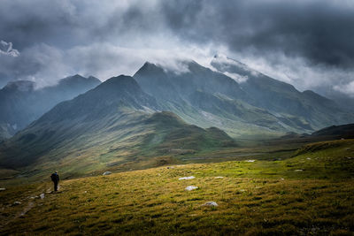 Rear view of mountain range against sky