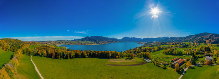 Scenic view of mountains against blue sky