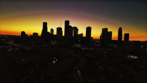 Silhouette of city at sunset