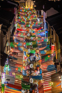 Illuminated lanterns hanging in market at night