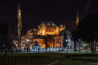 Illuminated buildings in city at night