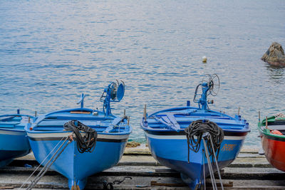 Boats moored at sea shore