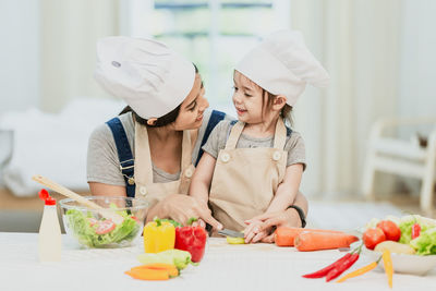 Midsection of woman holding ice cream
