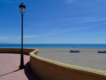 Shaped wall and beach on a sunny day in sabinillas spain