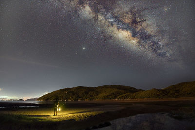 Scenic view of star field against sky at night