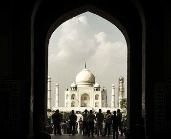 People in front of historical building