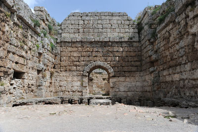 Stone walls of historic old ruins in city