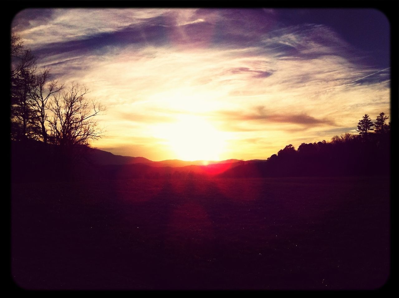 sunset, sky, silhouette, transfer print, sun, tranquil scene, tranquility, scenics, landscape, cloud - sky, beauty in nature, tree, auto post production filter, nature, sunlight, cloud, sunbeam, idyllic, bare tree, cloudy