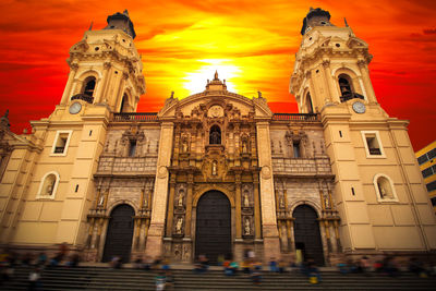 Low angle view of historic building against sky during sunset