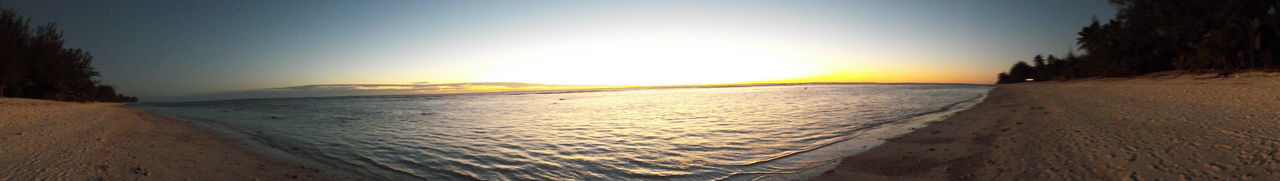 Scenic view of sea against clear sky during sunset