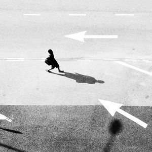 Full length of a young woman on road