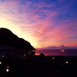 Scenic view of sea against sky at dusk