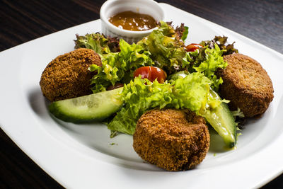 Close-up of served food in plate