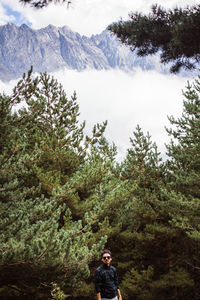 Man on mountain against trees