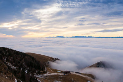 Scenic view of mountains against sky during sunset