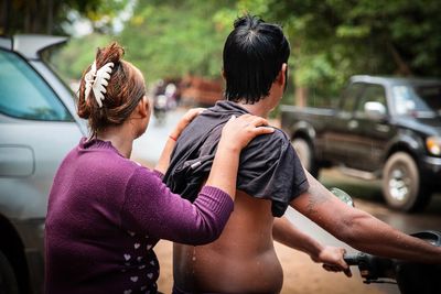 Rear view of women with umbrella