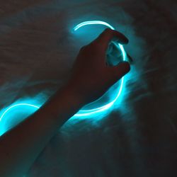 Close-up of hand holding light painting