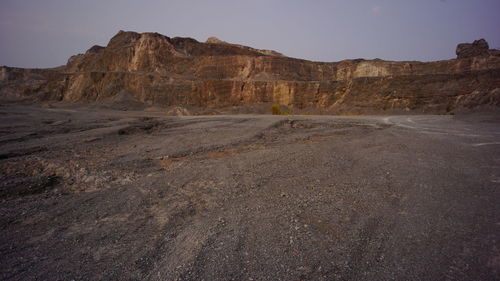 Rock formations in desert against sky