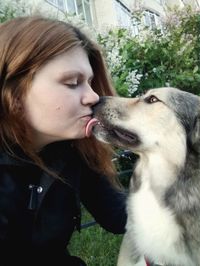 Close-up of woman with dog