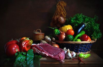 Close-up of fruits and vegetables in basket on table