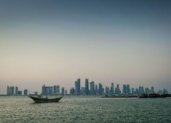 Scenic view of sea and buildings against sky