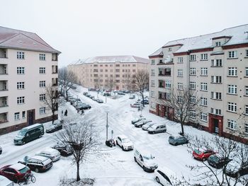 View of cityscape against clear sky during winter