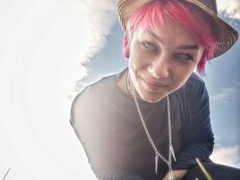 Portrait of a smiling young woman outdoors