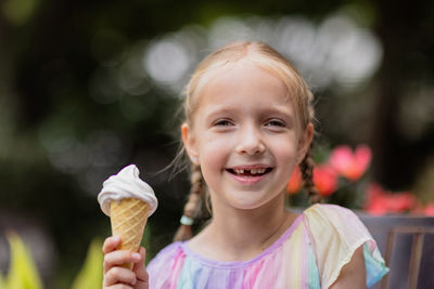 Portrait of cute girl holding ice cream cone