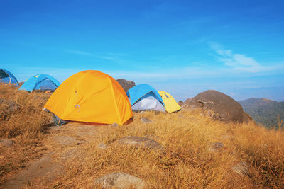 Tent on field against sky