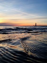 Scenic view of beach against sky during sunset