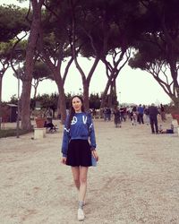 Portrait of woman standing in park
