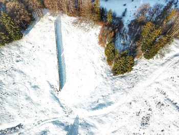 High angle view of icicles on snow covered land
