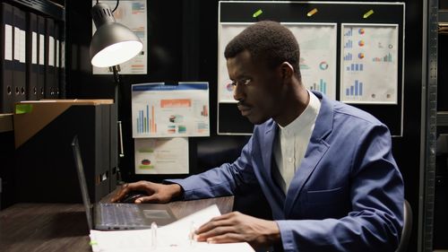 Side view of man working at home