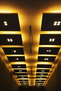 Low angle view of illuminated modern building