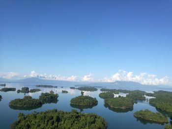 Scenic view of lake against blue sky