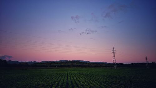 Scenic view of field against sky during sunset