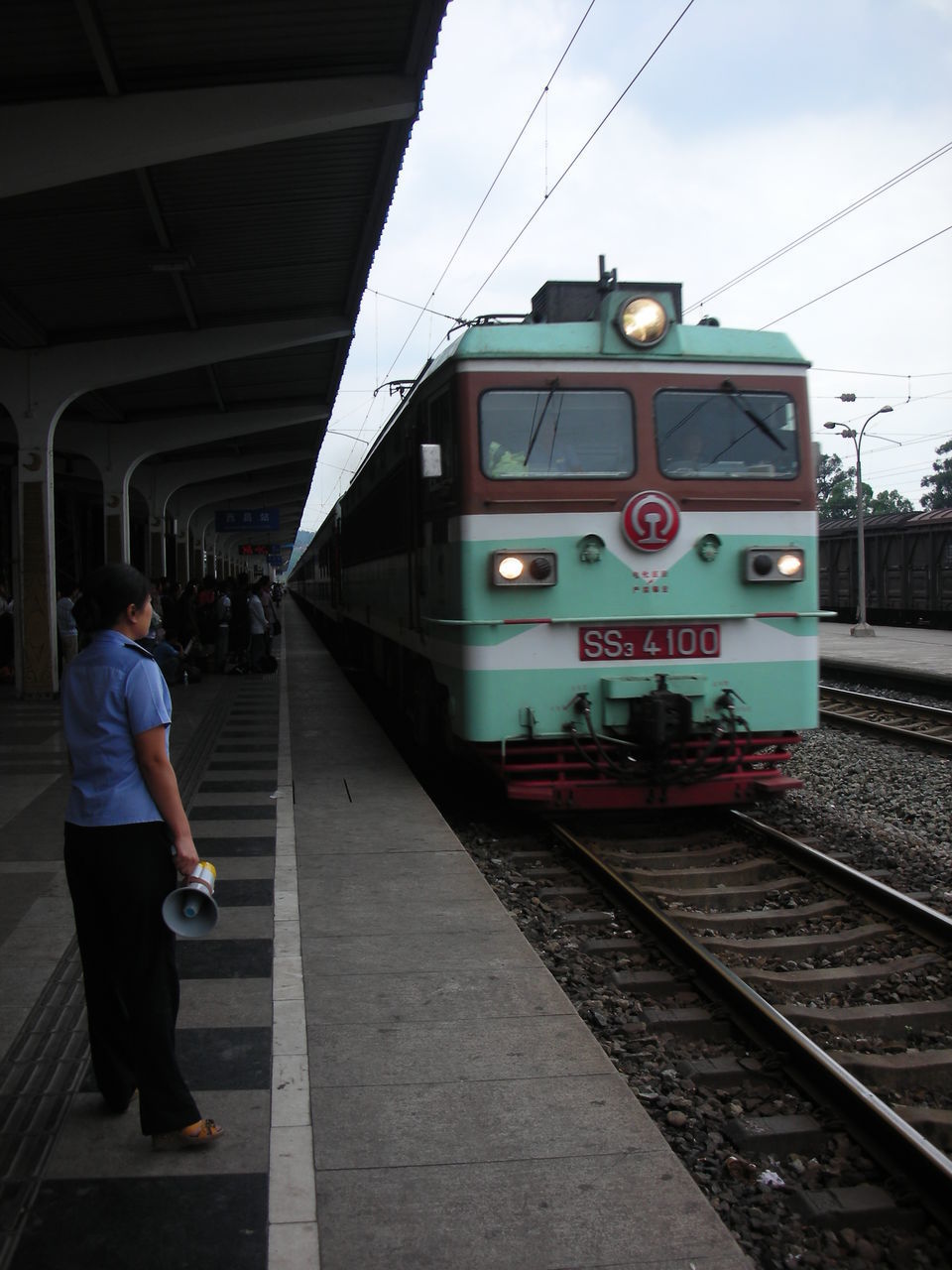 TRAIN ON RAILROAD STATION PLATFORM