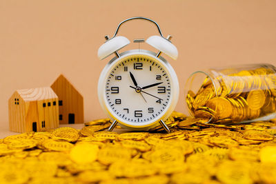 Close-up of clock on table